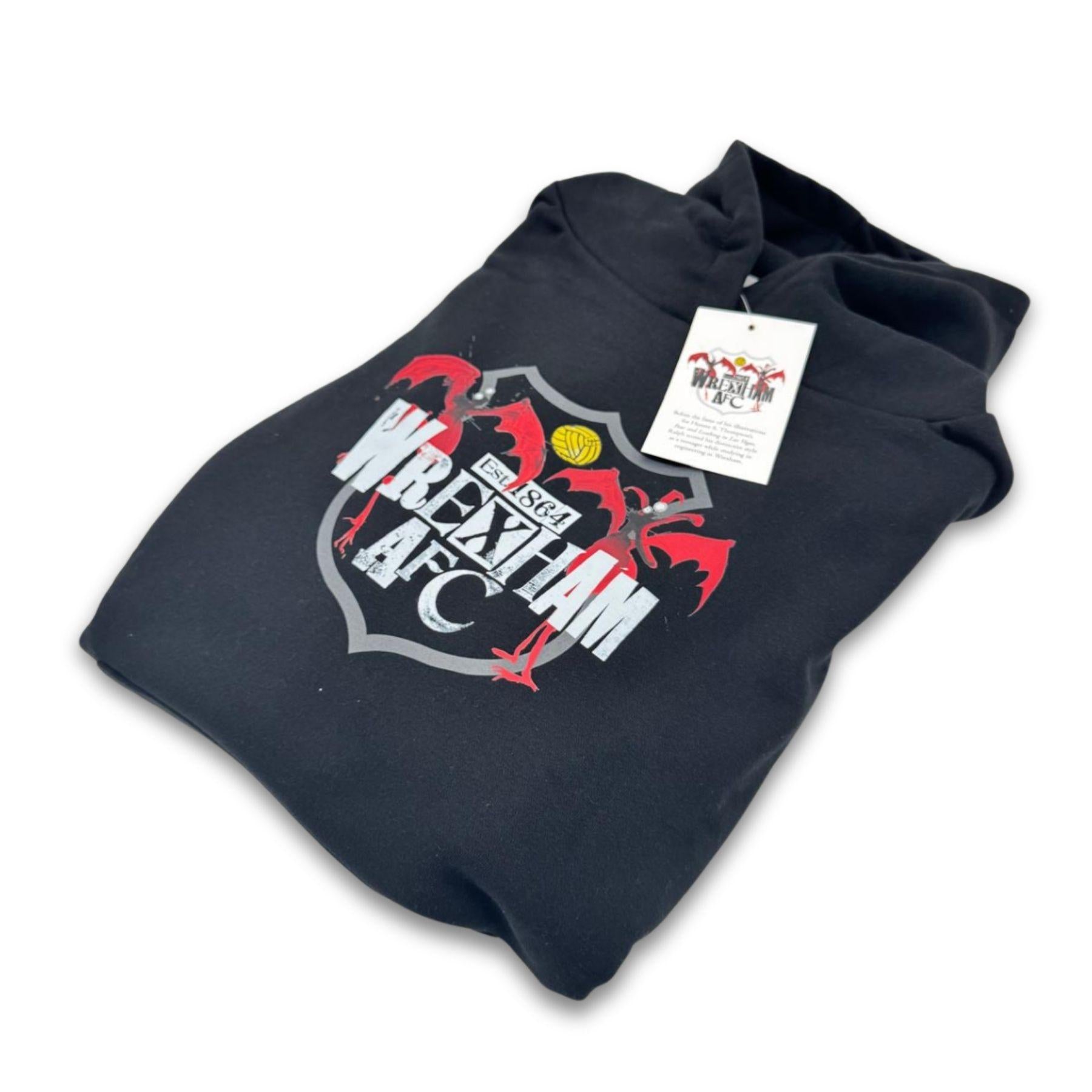 Folded black hoodie with a logo and text on a white background