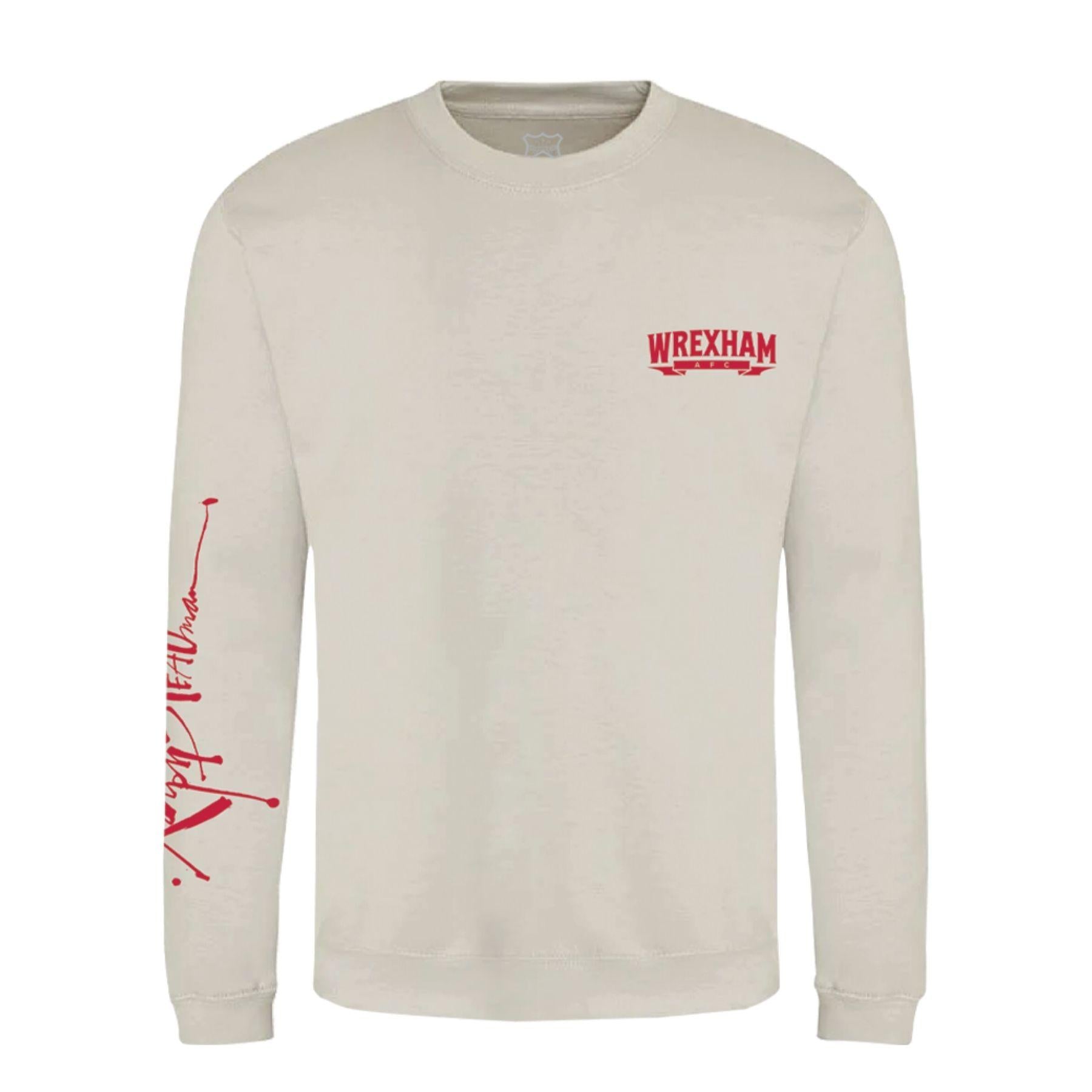 Beige long-sleeve shirt with red text and graphics on a white background