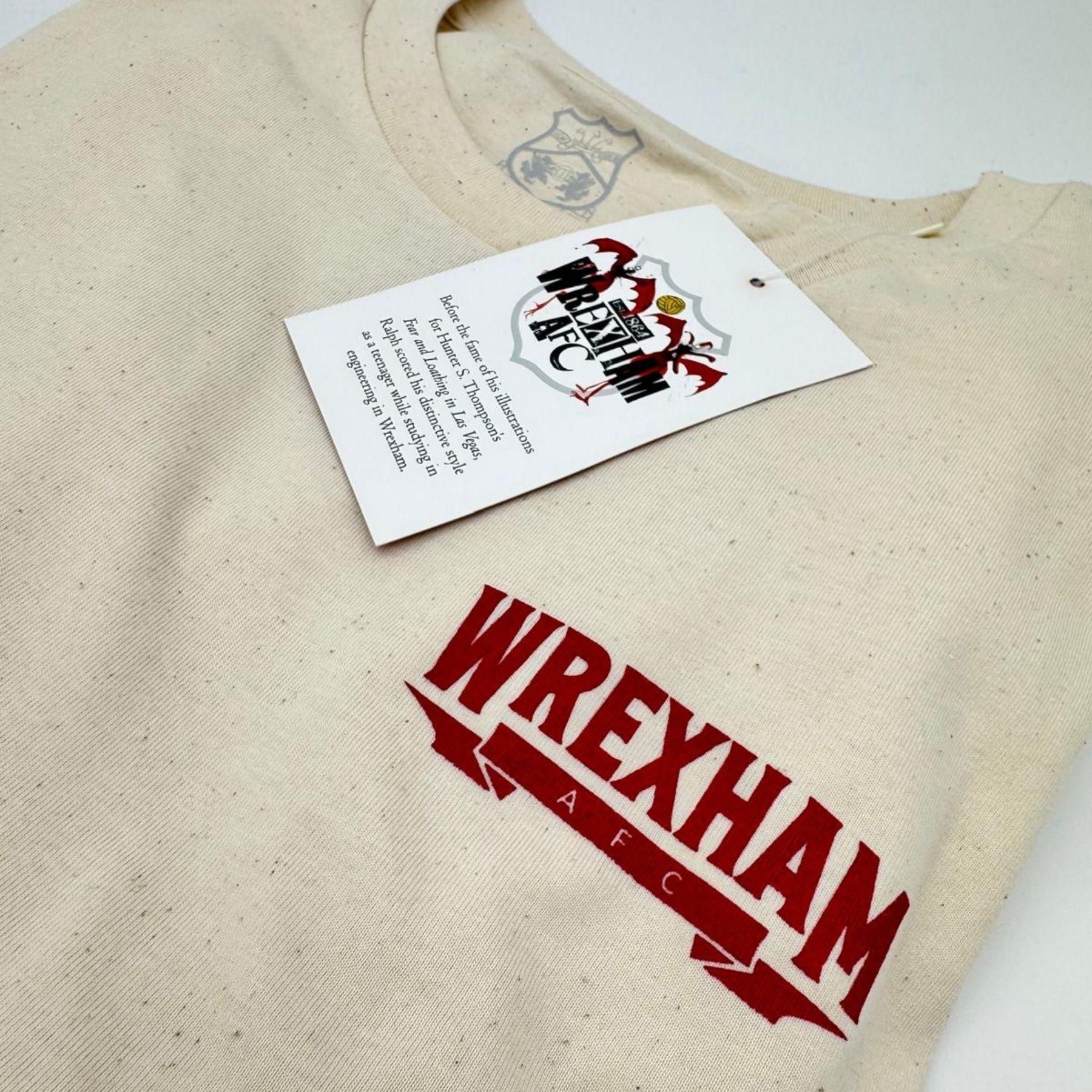 Beige tote bag with 'Wrexham AFC' printed on it, featuring a logo and text.