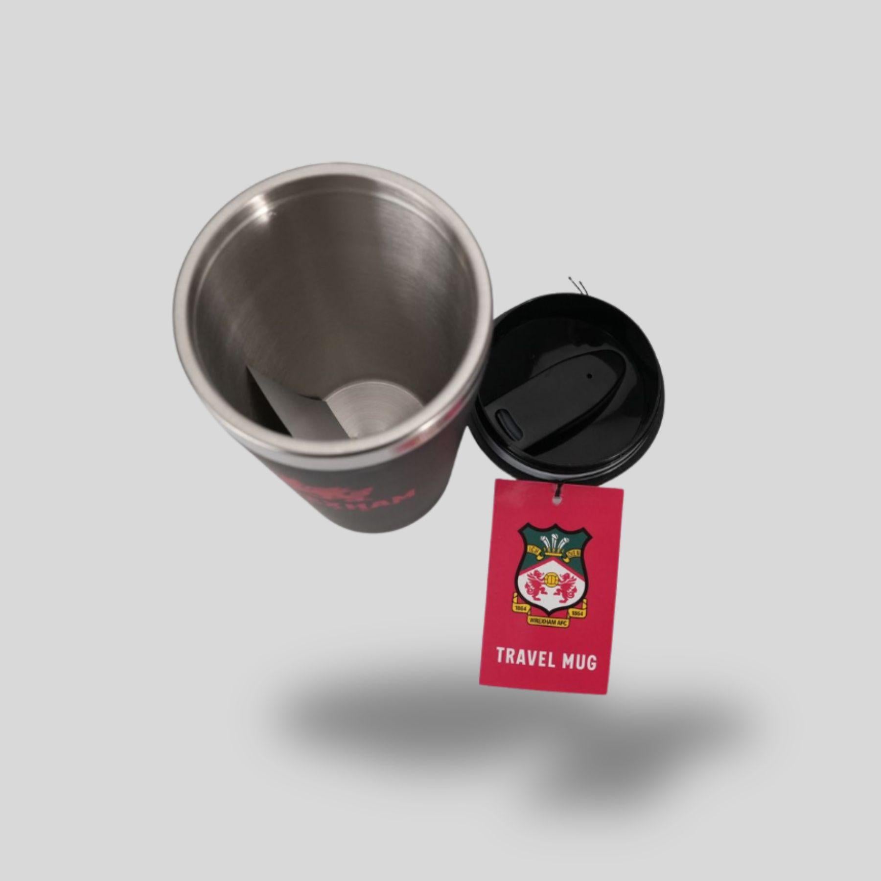 Stainless steel travel mug with a red tag on a light gray background