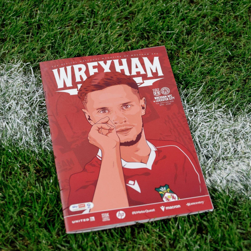 Book or magazine cover with a person's face on a grass background